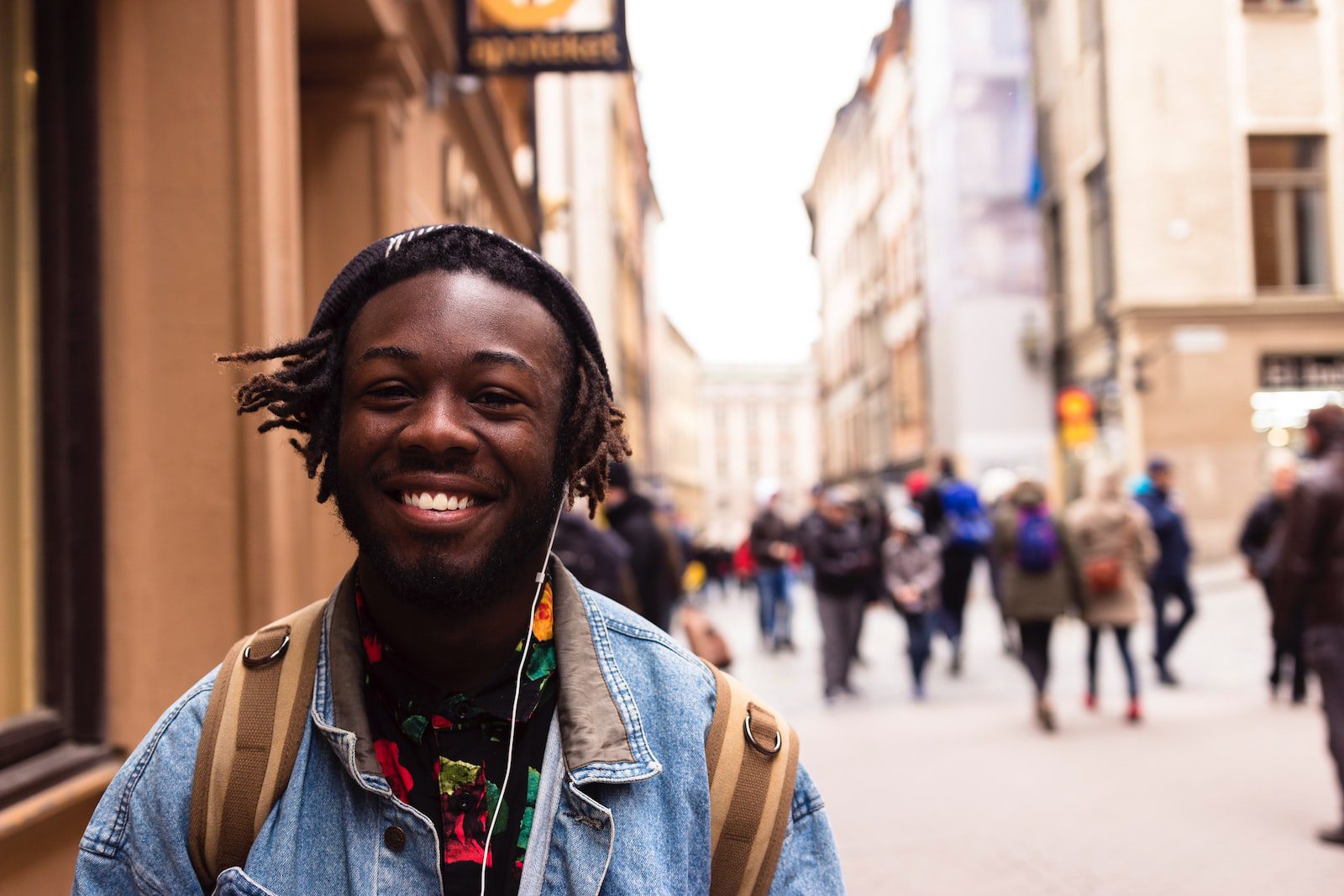 selective focus of man smiling near building