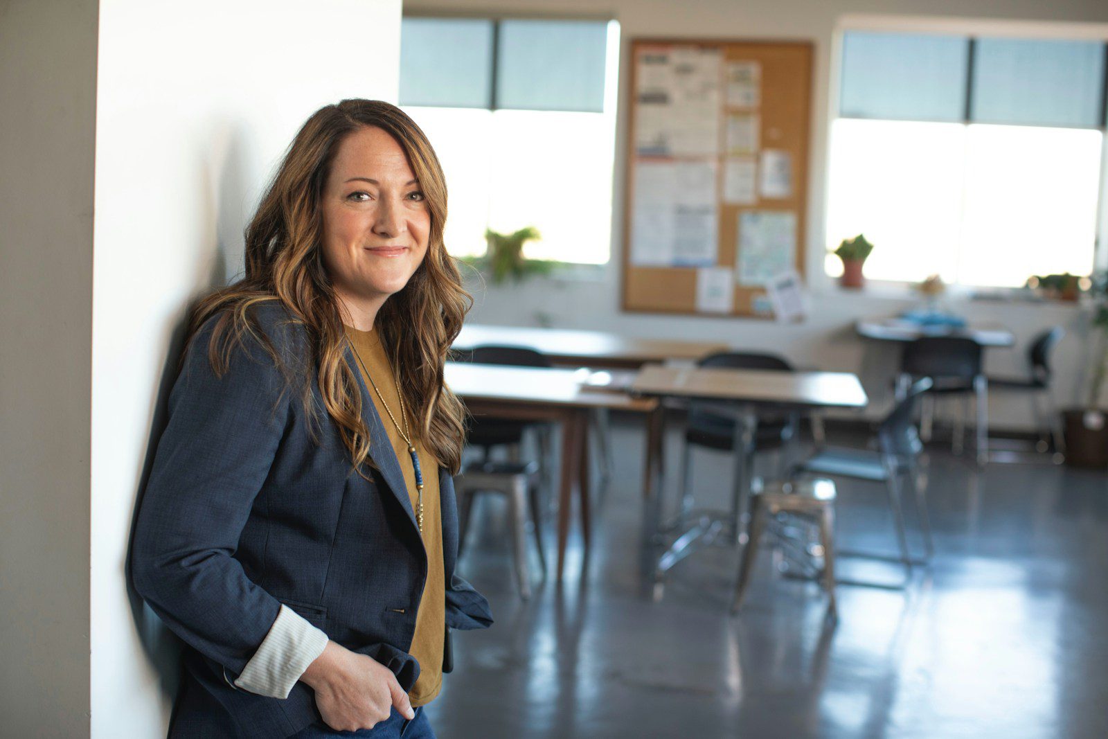Photo by LinkedIn Sales Solutions woman in black coat sitting on chair